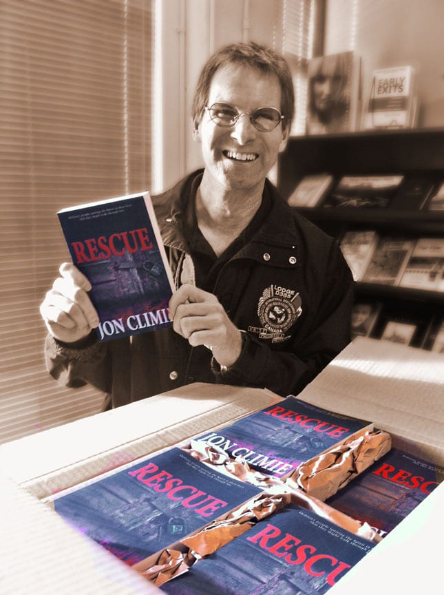 Jon Climie picking his newly printed book, "Rescue".